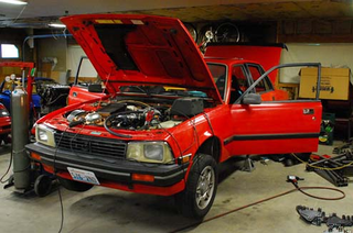 Illustration for article titled Index Of Effluency Bar Set Unreasonably High For Thunderhill: Peugeot 505 Turbo or Chevy Corvair?